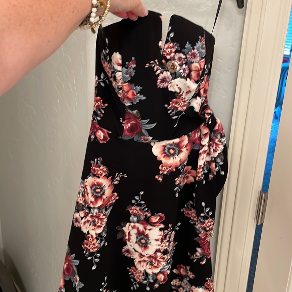Strapless mini dress with tie on side. Black with floral print